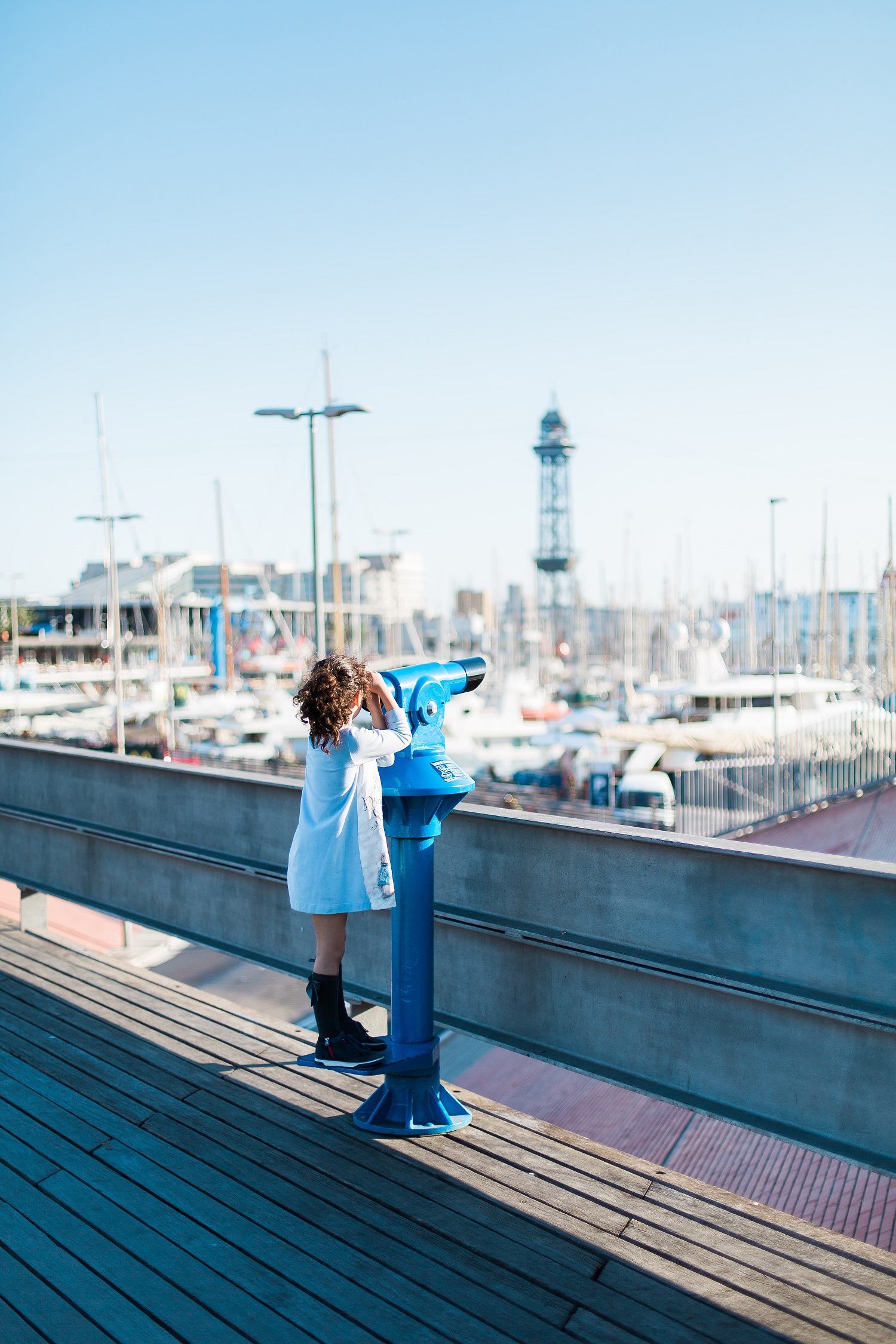 girl overlooking yacht port